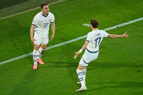 Switzerland's Xherdan Shaqiri celebrates after scoring opening goal against Scotland